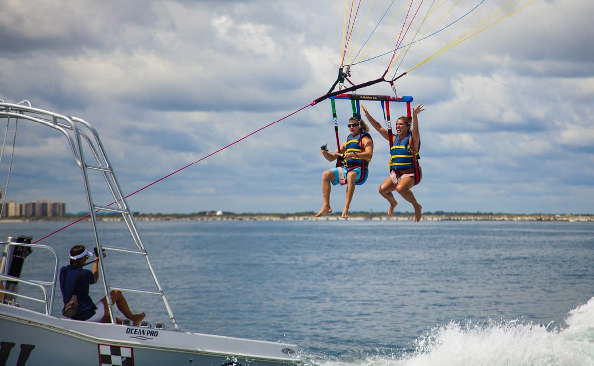 The Daytona Beach Parasail crew helping guests prepare for a flight.